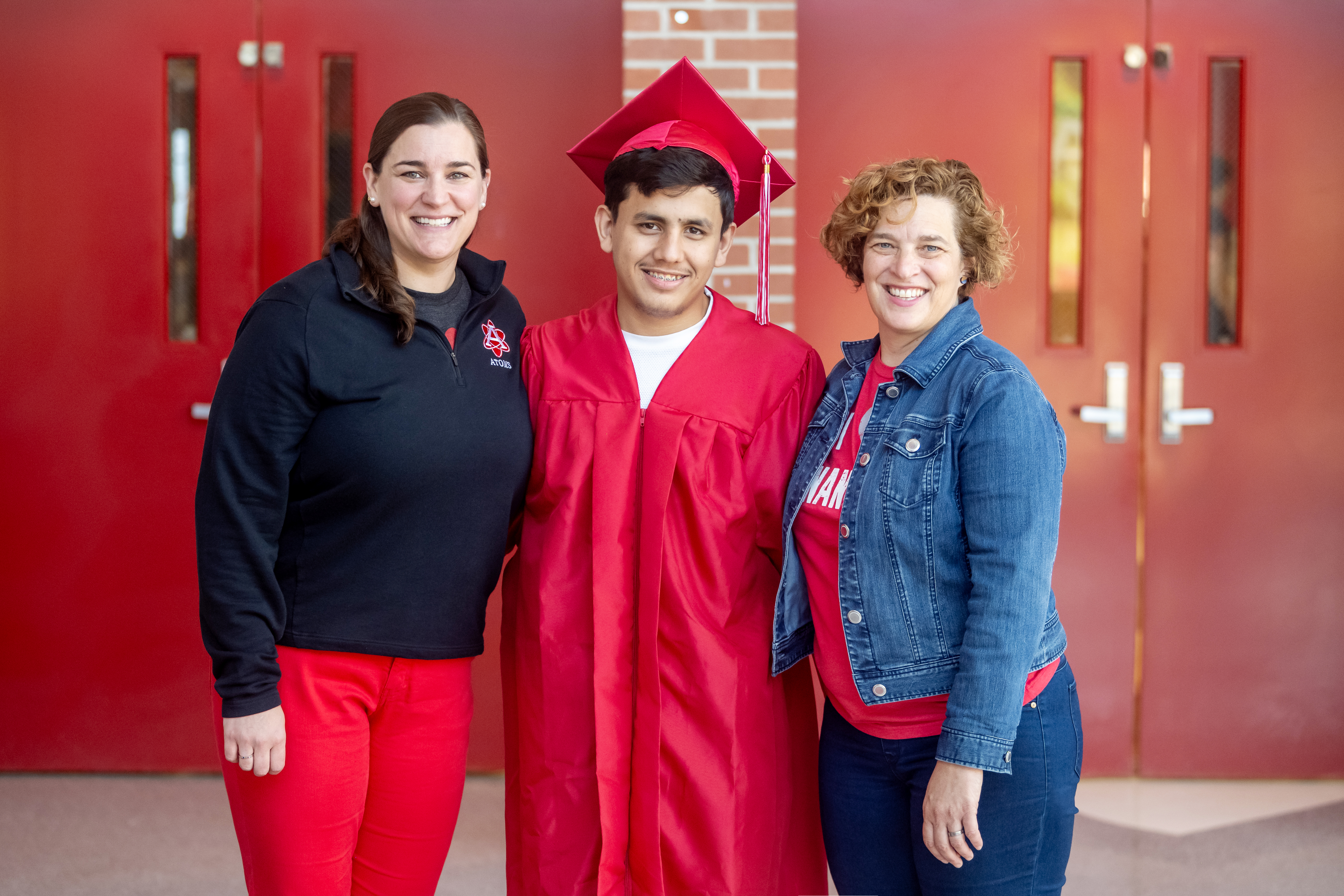 Annandale senior Samiullah Luddin stands with Multilingual Department Chair Meredith Hedrick and Multilingual teacher Tricia Kapuscinski, two of many educators who supported him on his path to graduation.